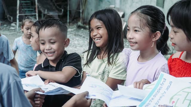 Children smiling over their Bible lesson